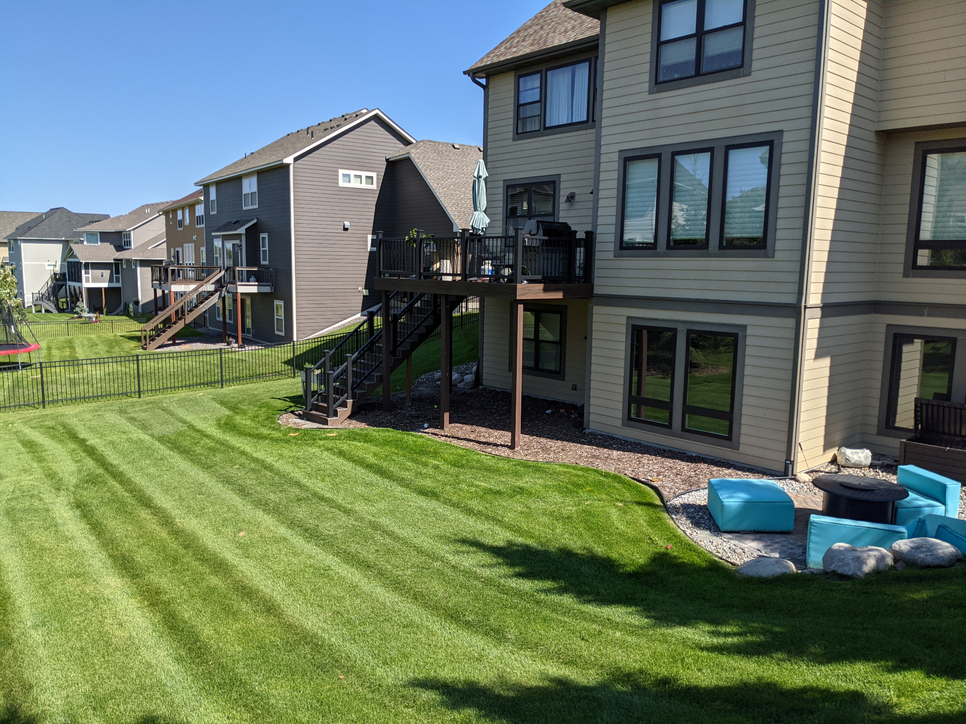 Backyard Lawn Maintenance and Weed Prevention in Plymouth, MN