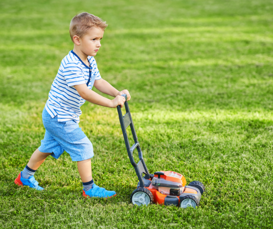 Lawn mower being inspected and maintained before use