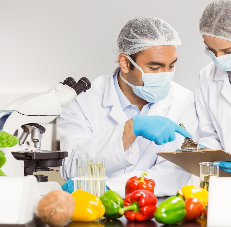Lab technicians testing fresh produce for pesticide residue